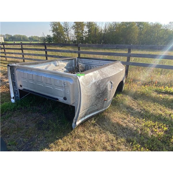 Approx 2010 Dodge Dually box and tailgate small dent on the passenger side