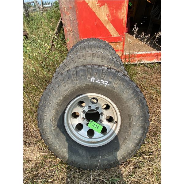 Four 8 Hole Mags c/w 75R16 Tires (Decent)