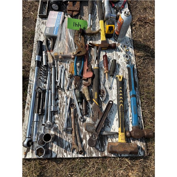 Large Quantity of Tools on Plywood