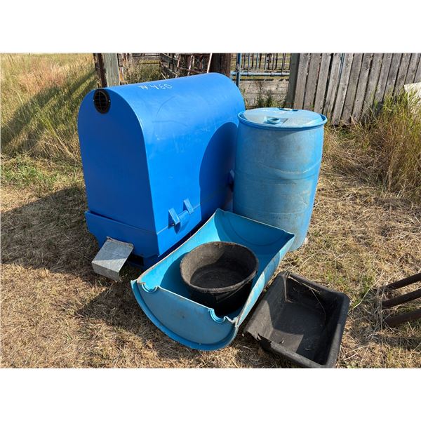 Blue calf hut, barrels and plastic feeders