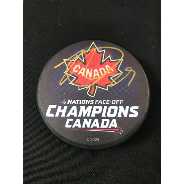 NATHAN MCKINNON SIGNED 4 NATIONS HOCKEY PUCK GCG HOLO