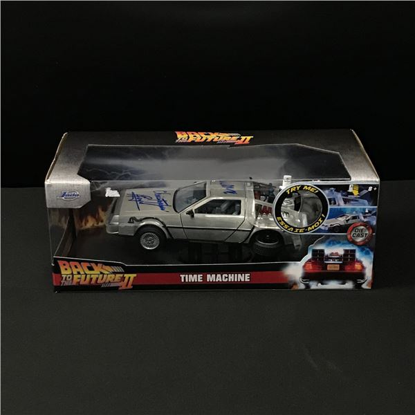 MICHAEL J FOX AND CHRISTOPHER LLOYD SIGNED DIE CAST BACK TO THE FUTURE CAR WWOC COA