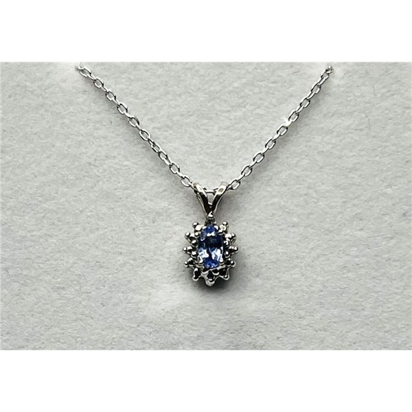 14KT WHITE GOLD NATURAL TANZANITE AND DIAMOND PENDANT WITH STERLING SILVER CHAIN, RETAIL $500.00. TA