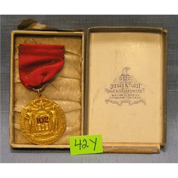 Early gold filled basketball medal and ribbon
