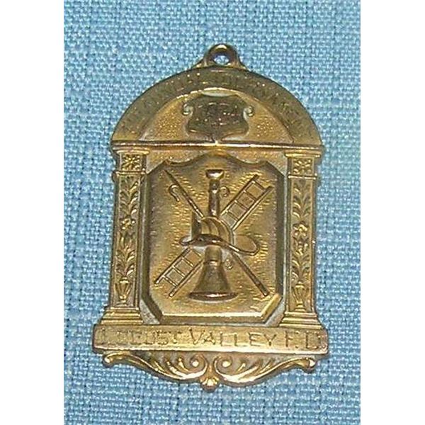 Antique first place ladder climbing award badge