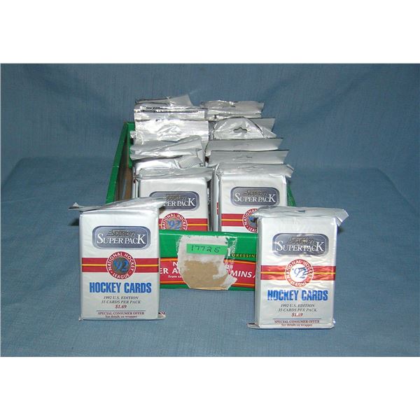 Box full of unopened hockey card packs