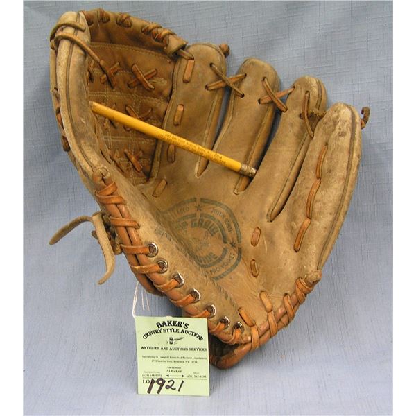 Vintage leather baseball glove: the backhanded