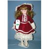 Image 1 : Porcelain doll in fancy maroon dress