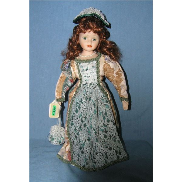 Porcelain doll with beatuful gown and pearl necklace