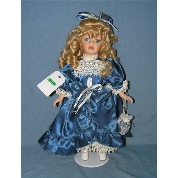 Fancy porcelain doll with silk dress