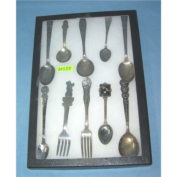 Collection of character and souvenir spoons