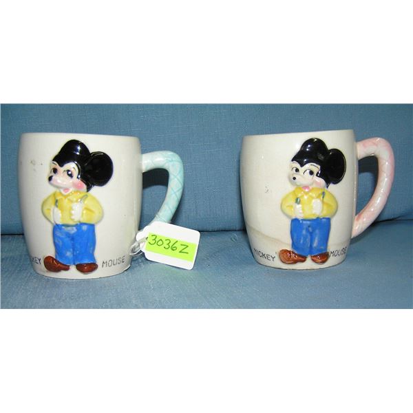 Pair of great early Mickey Mouse milk mugs