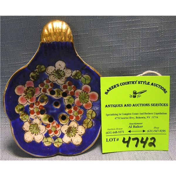 Vintage porcelain strainer/spoon rest