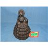 Cast iron woman doorstop with long dress and bonnet