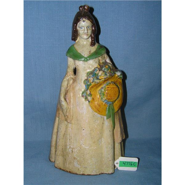 Hand Painted cast iron southern bell holding hat and flower