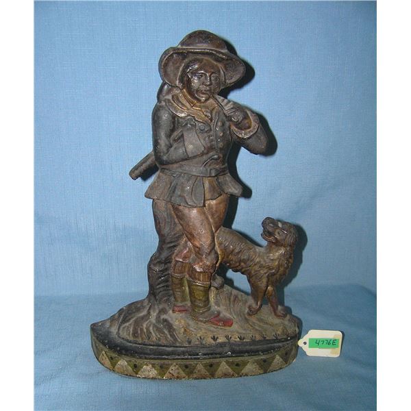 Large cast iron woodsman with axe and smoking pipe