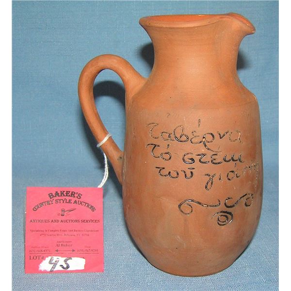 Hand painted earthenware pitcher