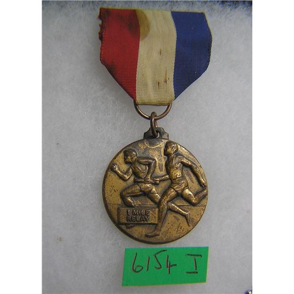 One mile relay runner's award medal and ribbon