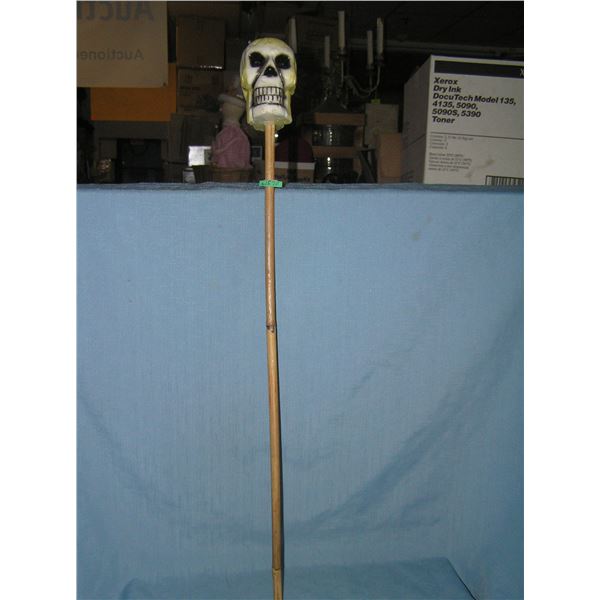Skelton head candle on display stick