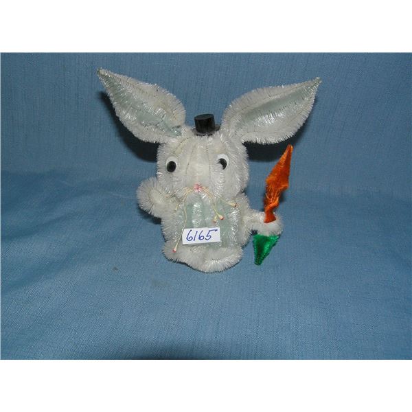 Early pipe cleaner made rabbit holding carrot