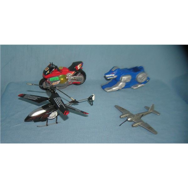 Group of classic toys inc. motorcycle, helicopter, classic metal plane & more