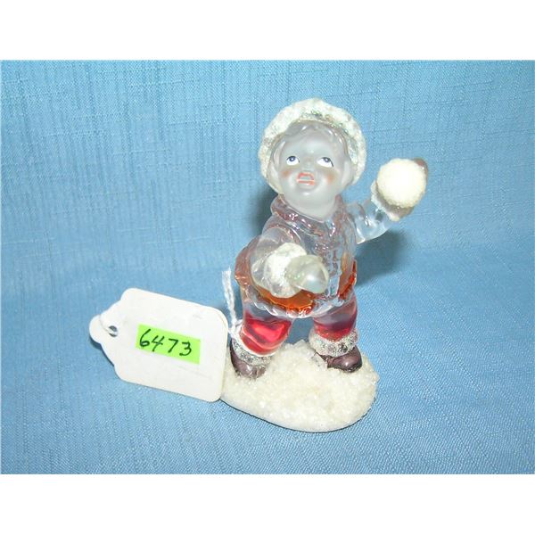 Colorized glass child figure with snowball