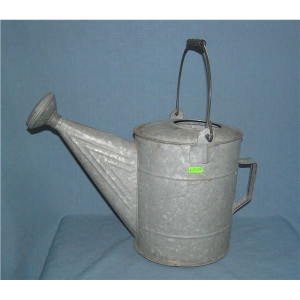 Antique metal watering can