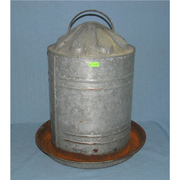 Antique metal chicken feeder