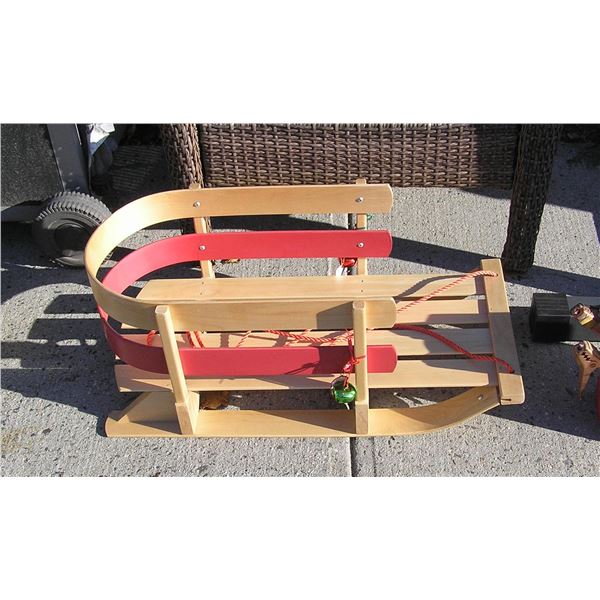 Child's sled complete with ribbons and bells