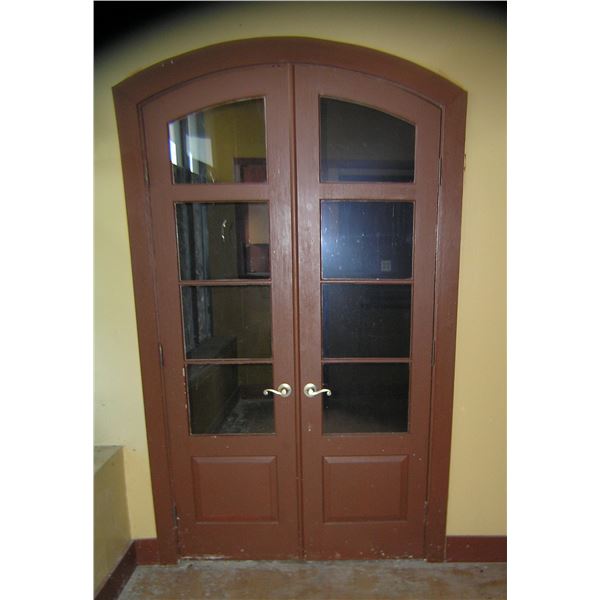 Pair of elegant 8 pane curved top hard wood doors