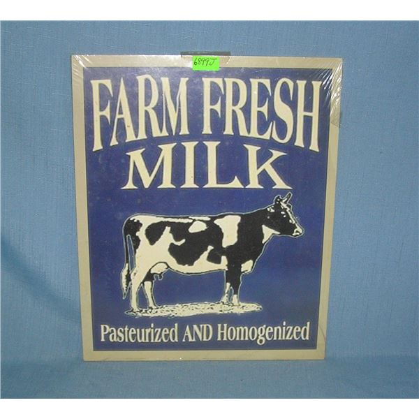 Farm fresh milk advertising sign on wood