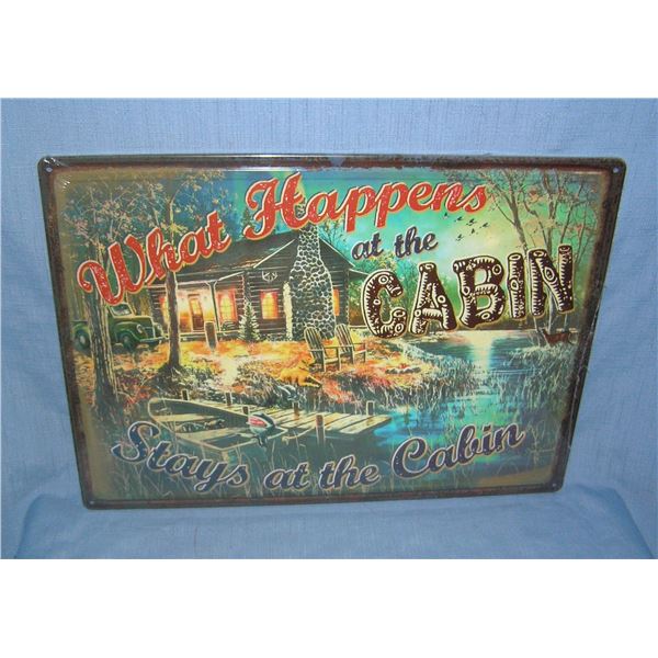 What happens at the cabin stays at the cabin all tin advertising sign