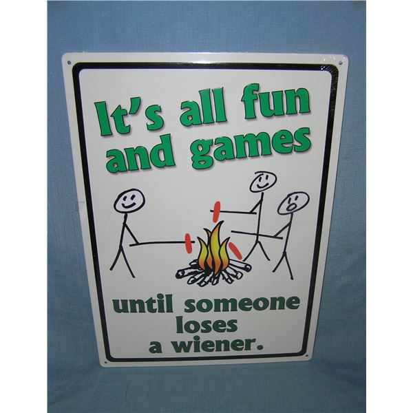 It's all fun and games until someone loses a wiener all tin advertising sign