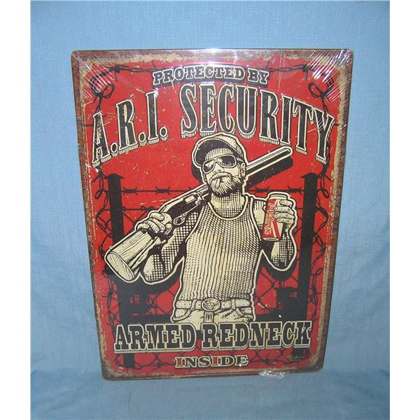 Protected by ARI security armed red neck  inside all tin advertising sign