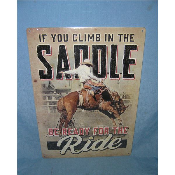 If you climb in the saddle be ready for the ride all tin advertising sign