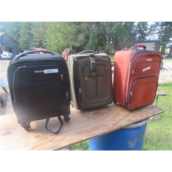 3 Rolling Suit Cases 