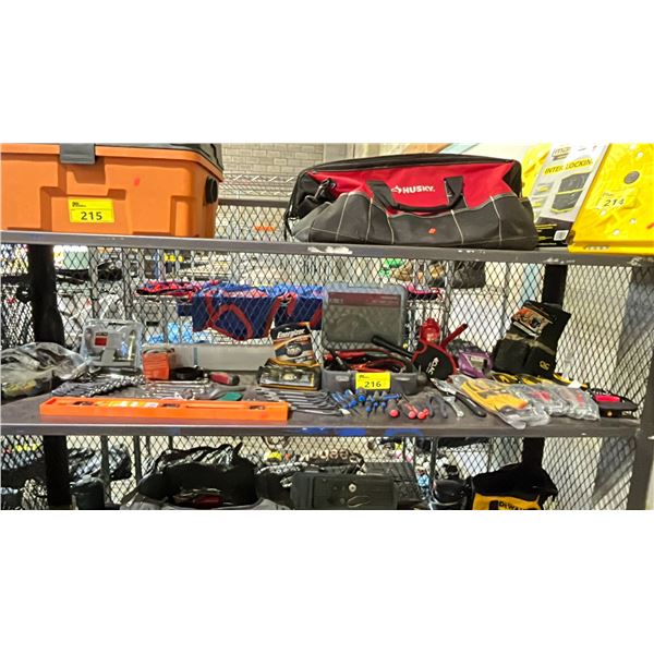 SHELF OF SCREWDRIVERS, COMBINATION WRENCHES, JUMPER CABLES, FATCO DOORKNOB, CAT RATCHET STRAPS,