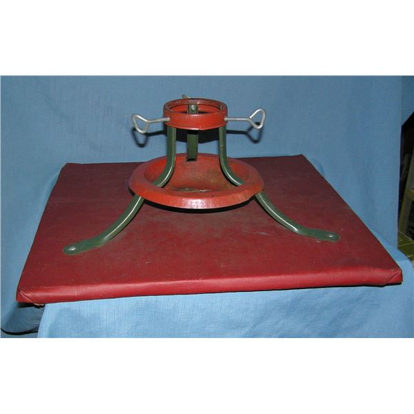 All metal Christmas tree stand on a wood base