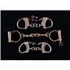 Image 1 : THREE SETS OF VINTAGE HANDCUFFS.
