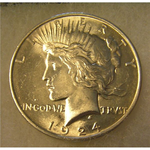 1924 Peace silver dollar in AU condition