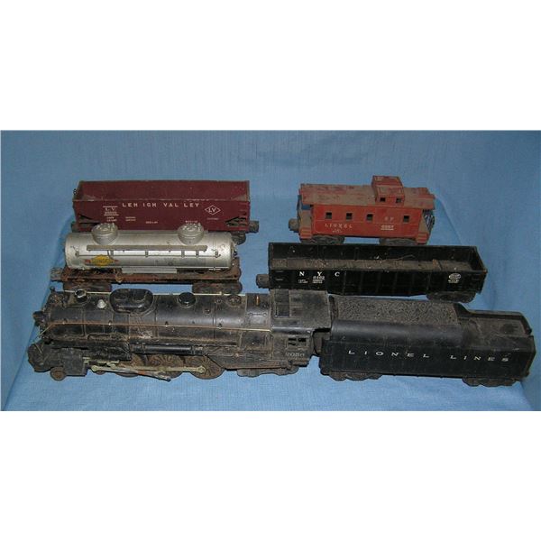 Box full of old Lionel trains