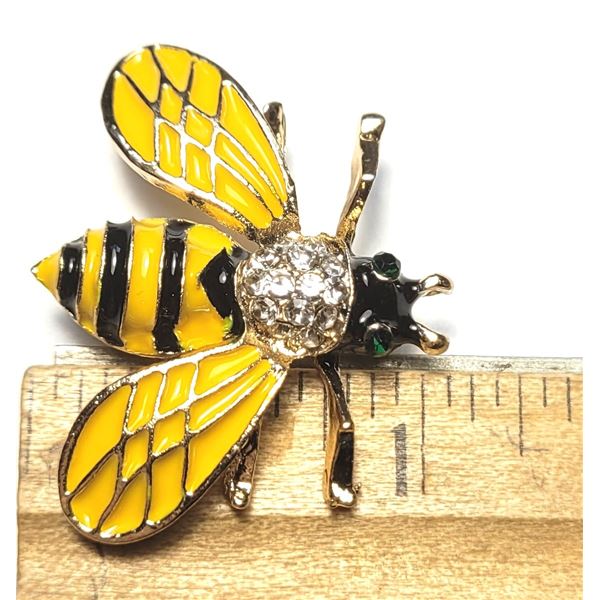 9)  GOLD TONE WITH YELLOW & BLACK ENAMEL