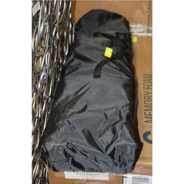 USED CAMPING COT IN A BLACK CARRYING BAG