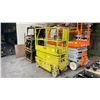 Image 1 : UPRIGHT INC. 65700 GREEN 30" X 62" INDUSTRIAL 500 LBS CAPACITY ELECTRIC MAN LIFT WITH EXTENSION BED