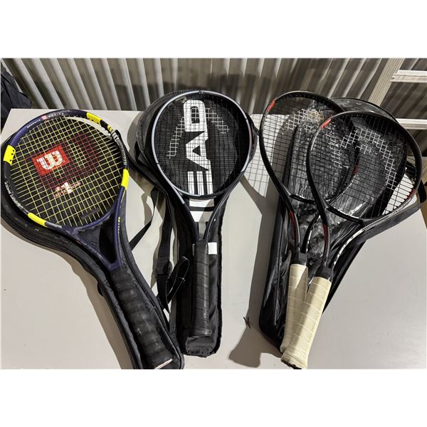 Four tennis rackets and bags