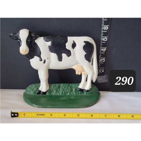 Cast iron milk cow door stop.