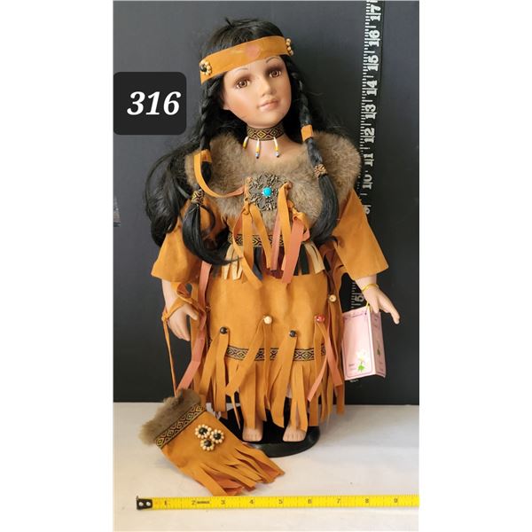 Sabre, hand crafted porcelain Native American girl in traditional dress.