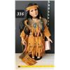 Image 1 : Sabre, hand crafted porcelain Native American girl in traditional dress.