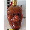 Image 2 : Crystal skull vodka & Devil hot sauce bottles.