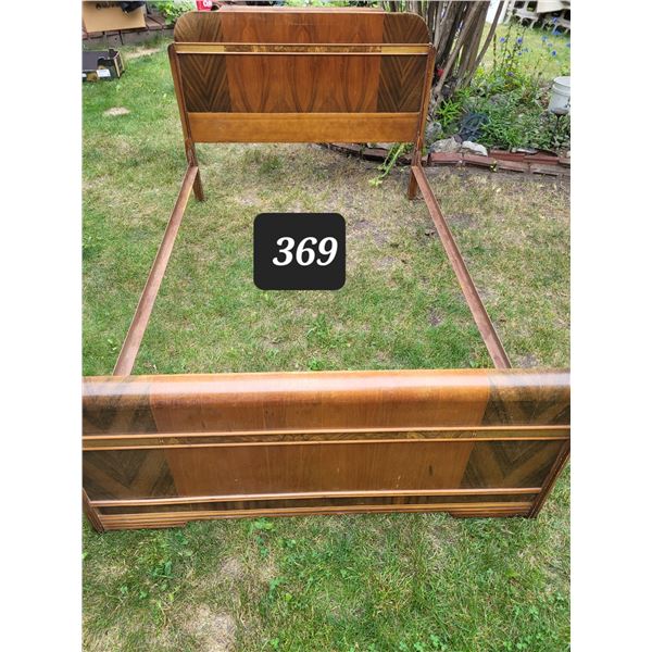 Early to mid century 48” bed.  Head & foot boards possibly walnut, with metal rails.